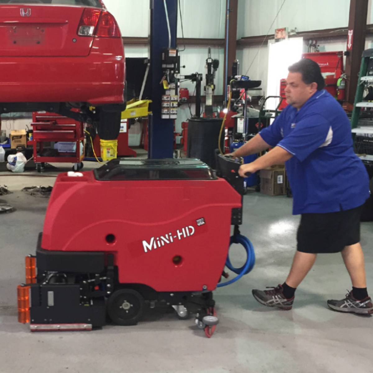Southern Sweepers Mini-HD keeping the work space safe and clean at a autoshop.
